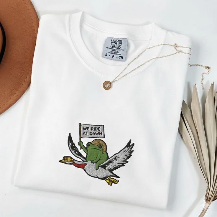 We Ride at Dawn T-Shirt, Frog and Goose Animal Graphic Tee, Whimsical Fantasy Style Top, Unisex Cotton T-Shirt, Sizes S-5XL