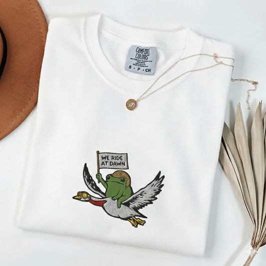 We Ride at Dawn T-Shirt, Frog and Goose Animal Graphic Tee, Whimsical Fantasy Style Top, Unisex Cotton T-Shirt, Sizes S-5XL